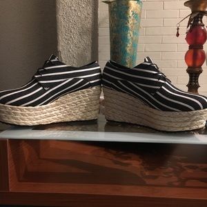 Lace up black and white stripe wedged shoe